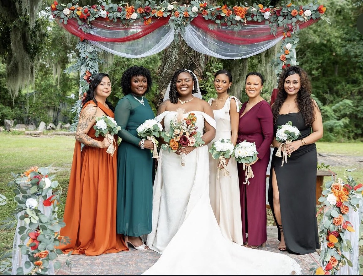 Bride and bridal party styled in jewel tones